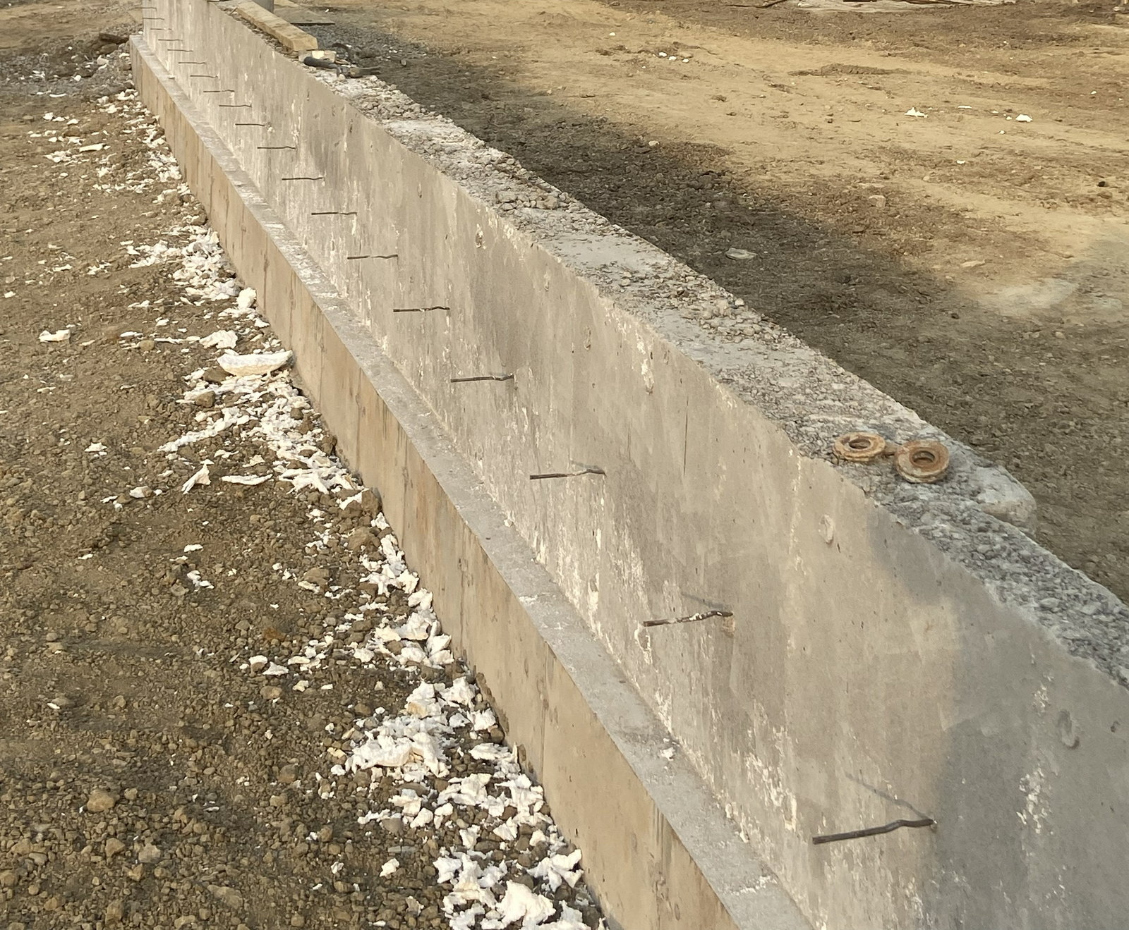 Finished concrete foundation wall and corner