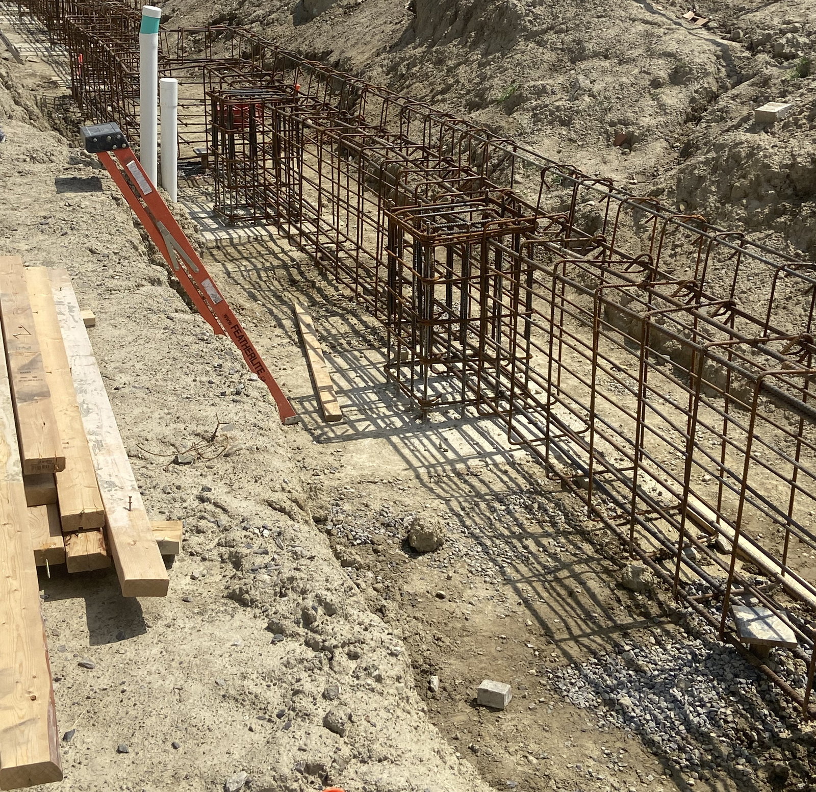 Reinforcing steel installed along an excavated foundation line