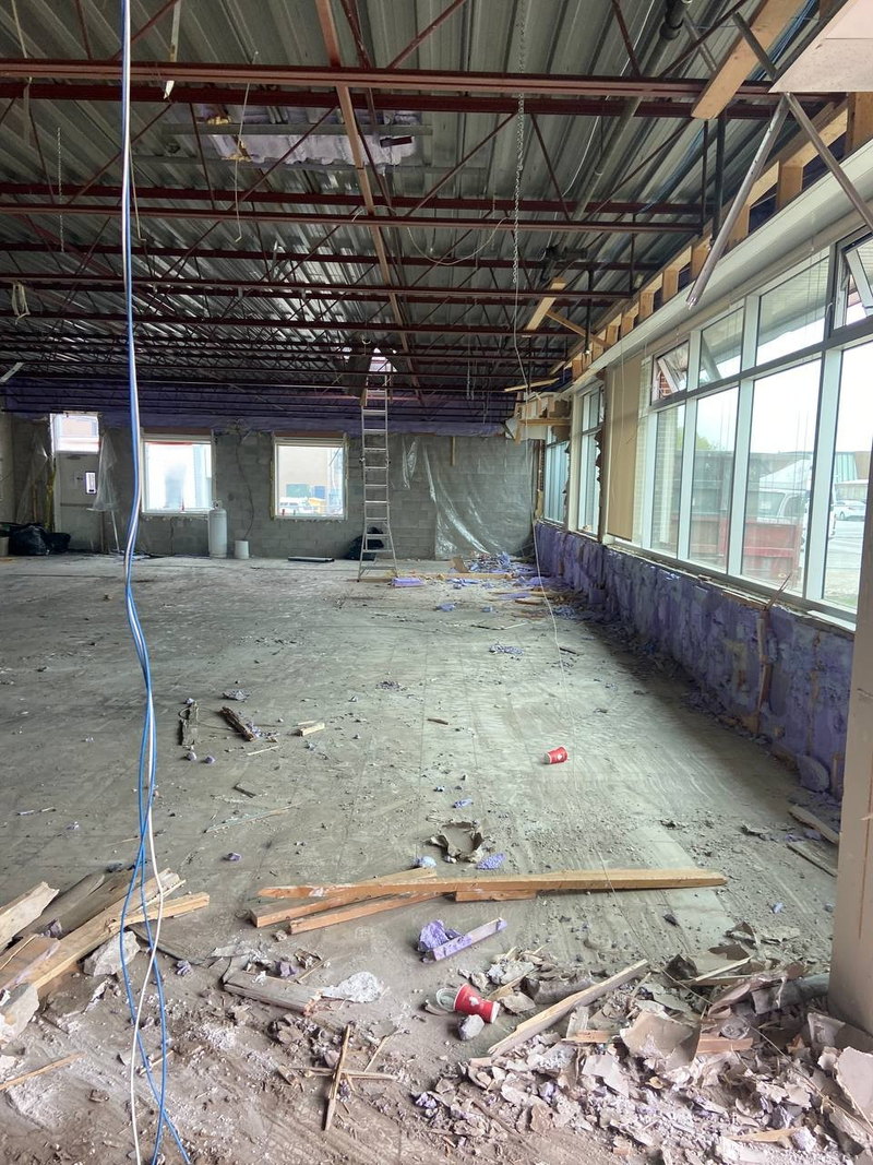 Cleared commercial interior with exposed ceiling structure