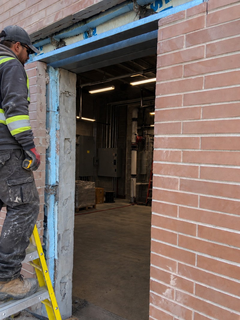 Prepared doorway opening in an existing brick wall