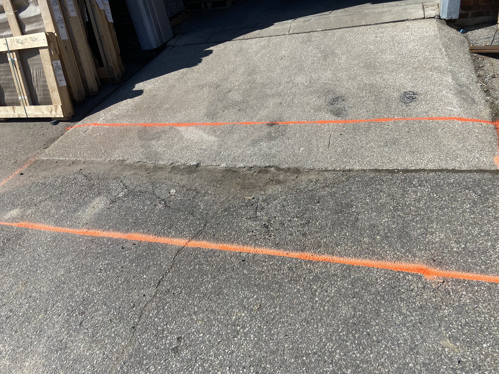 Existing concrete apron marked for cutting
