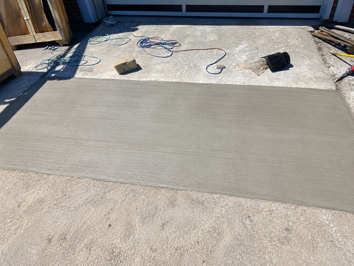 Finished concrete apron at a commercial overhead door