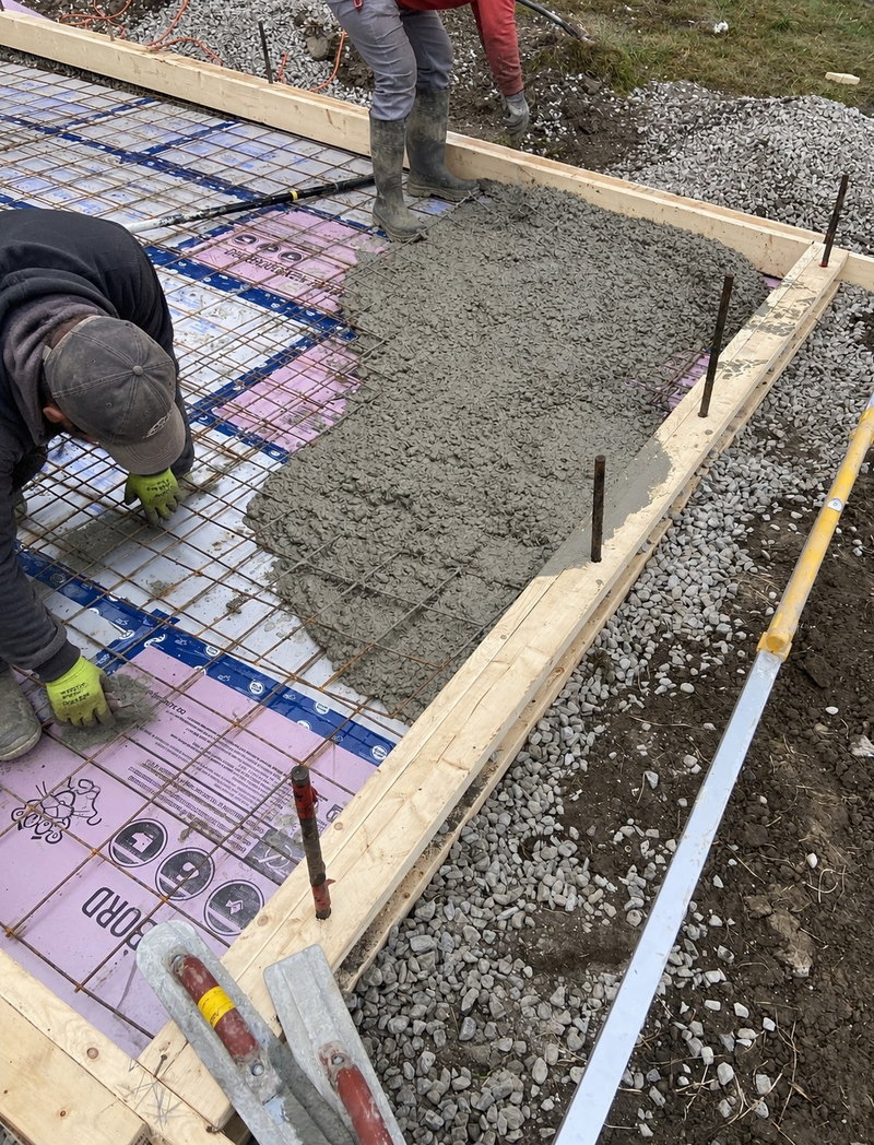 Concrete being placed over apron reinforcement
