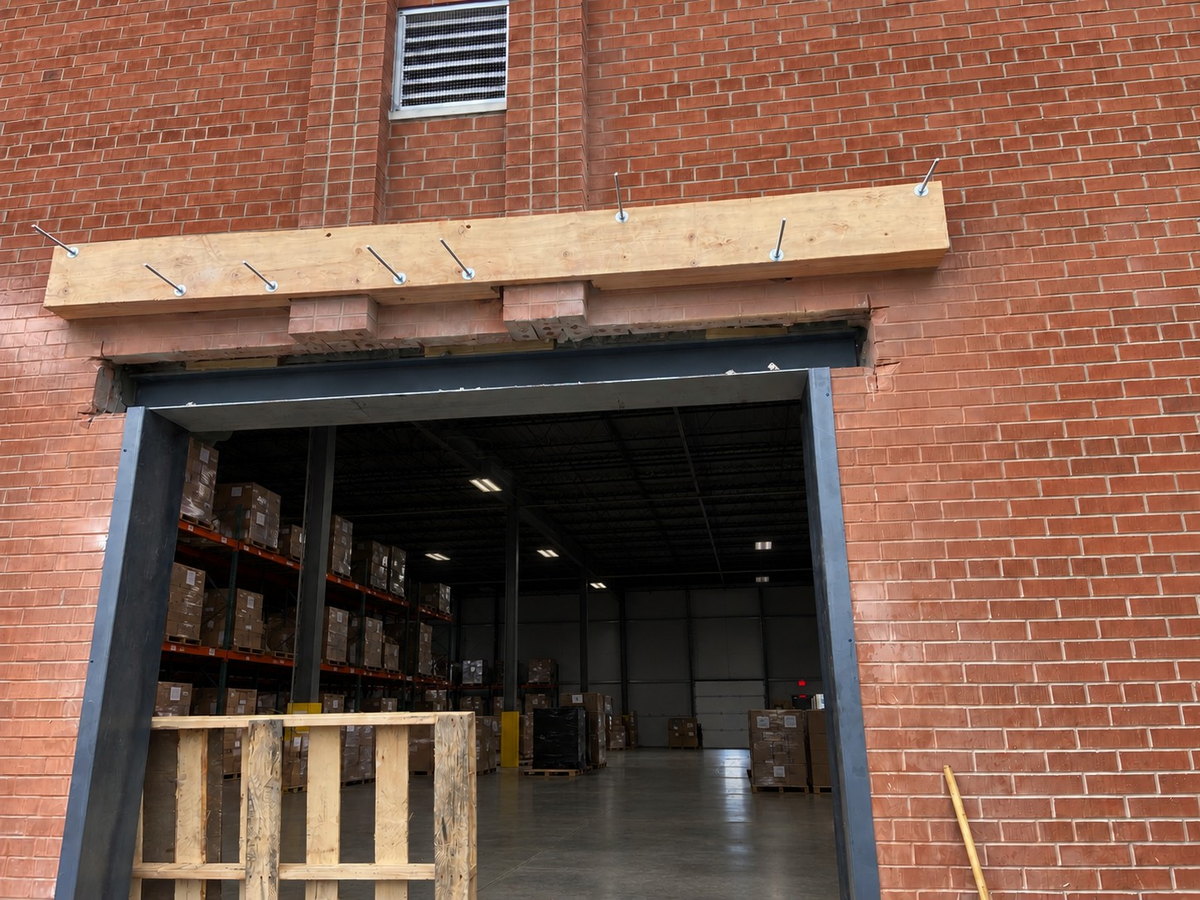 Commercial overhead-door opening before concrete apron construction