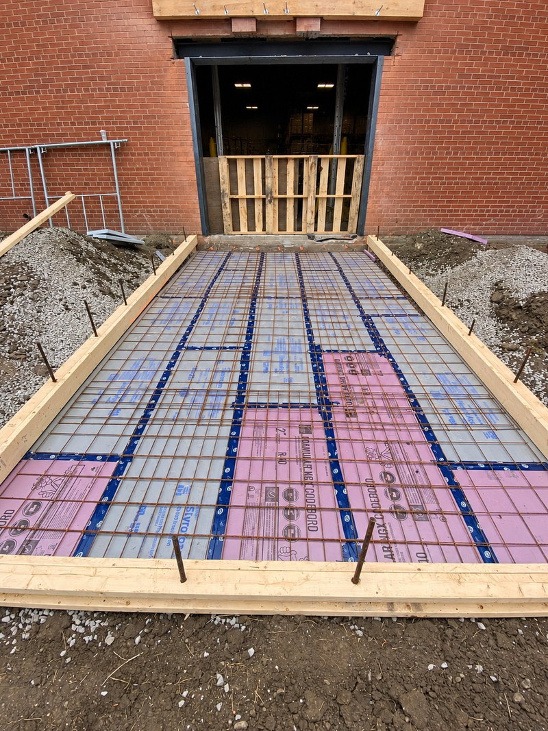 Insulation and reinforcing steel installed within concrete apron forms