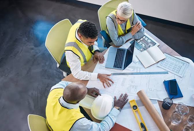 Construction team coordinating project plans