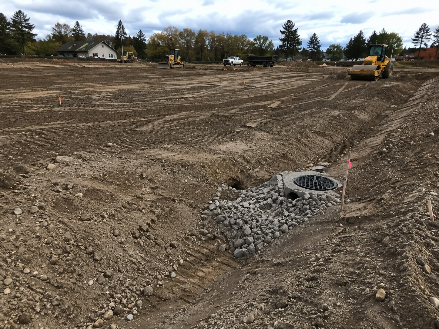 Excavator establishing site grades