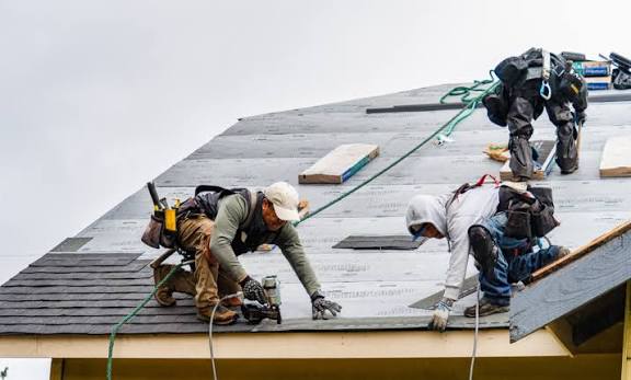 Roofing professional completing a roof repair