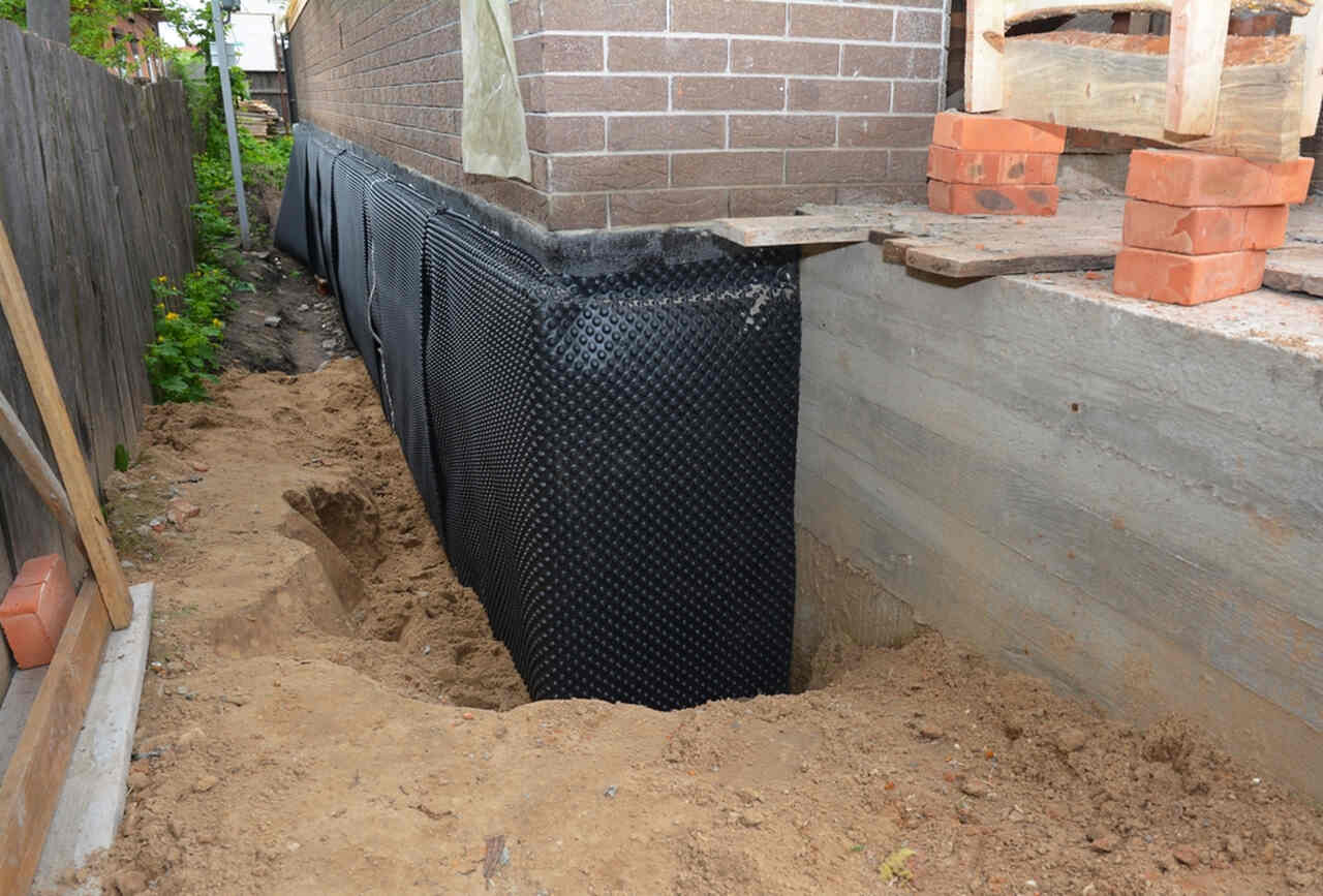 Foundation waterproofing and exterior envelope preparation